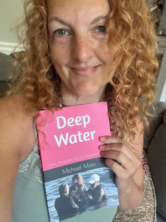 Sandra holding Deep Water by Michael Maio on Long Beach boardwalk Love1614