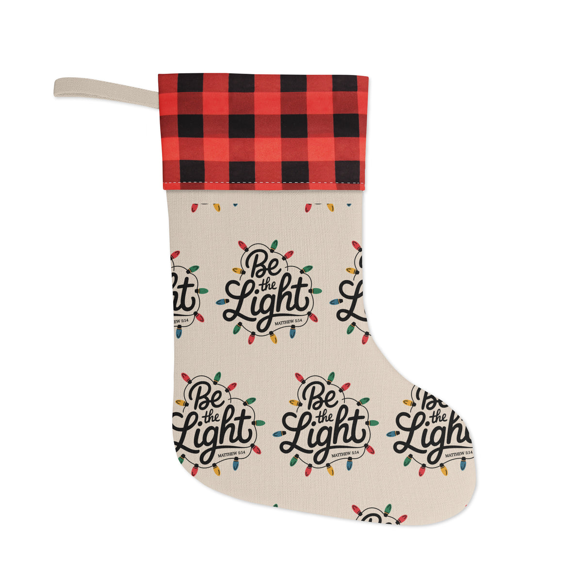 Be The Light Christmas stocking with Matthew 5:16 and buffalo plaid cuff, front view on white background