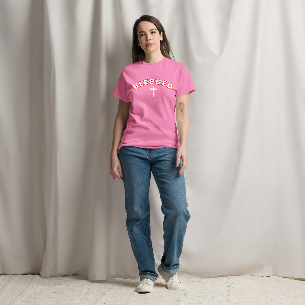 Woman wearing pink Blessed Cross Christian t-shirt, lifestyle shot