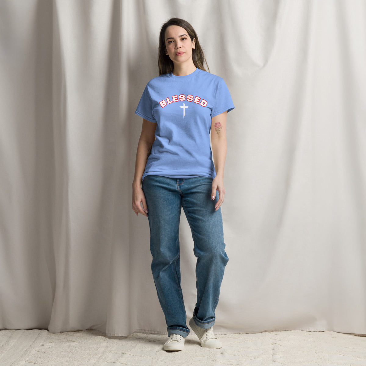 Woman wearing light blue Blessed Cross Christian t-shirt, lifestyle shot