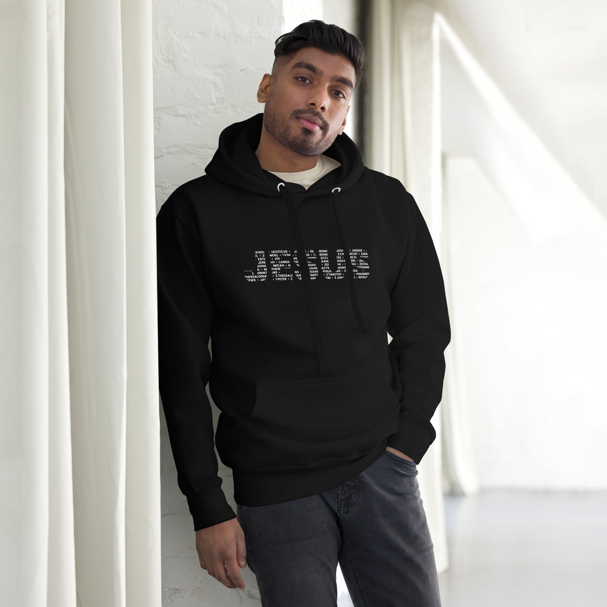 Man wearing Jesus 66 Books of the Bible Christian hoodie in black from Love1614